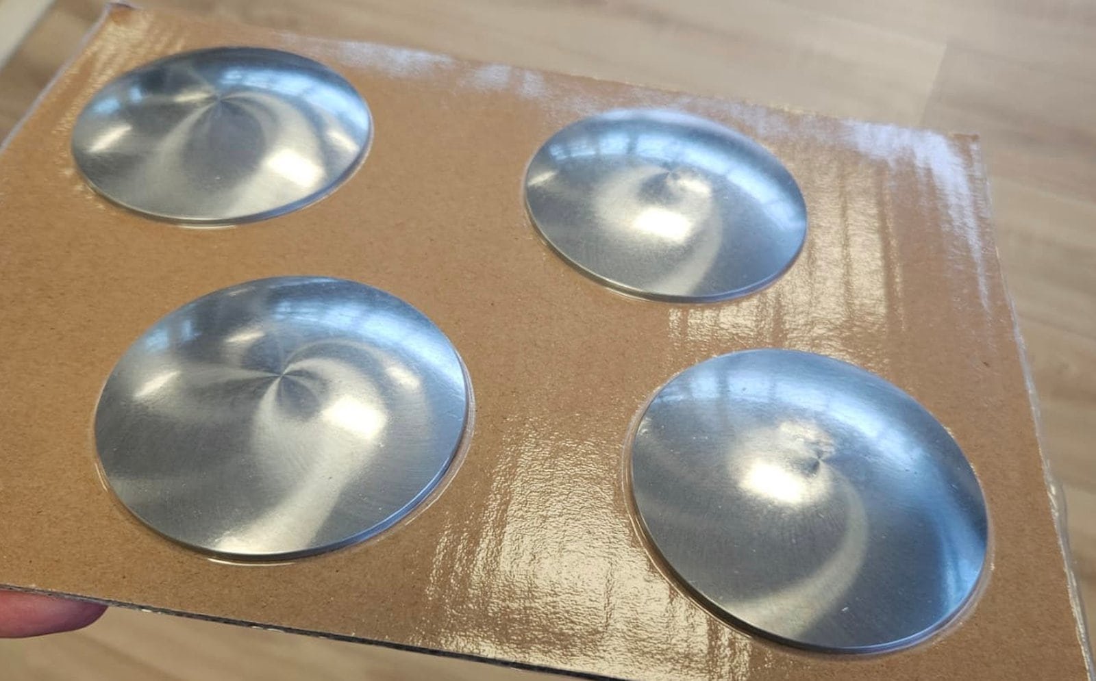 IR lens manufacturing equipment output — finished IR lens elements showing spherical, aspheric, and meniscus geometry types from a Vimfun lens production line