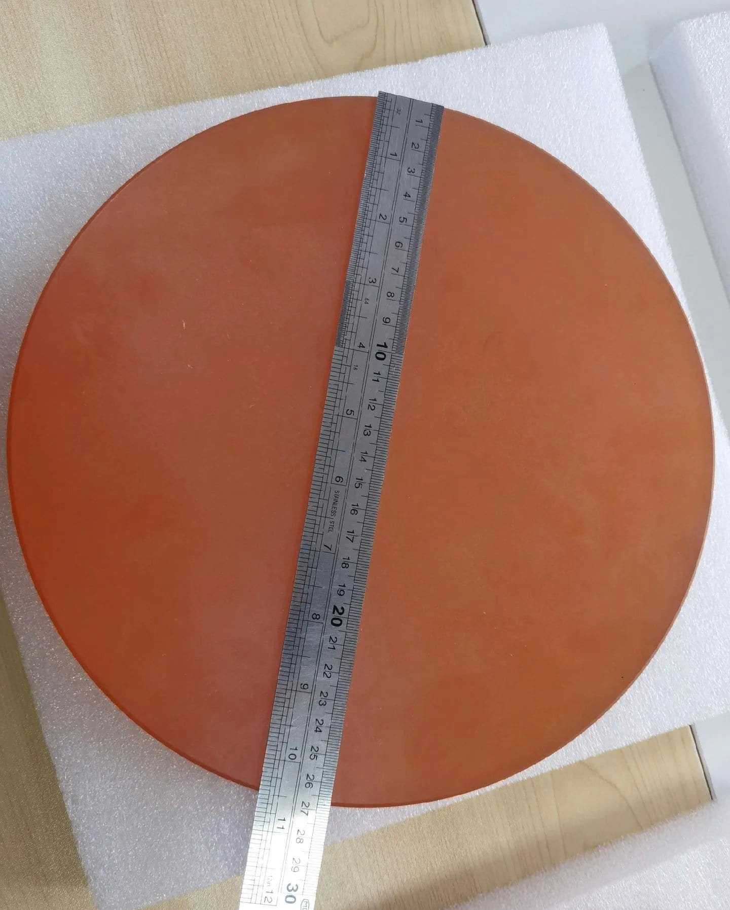 Sliced zinc selenide wafers after de-bonding from the carrier plate, showing uniform cut faces