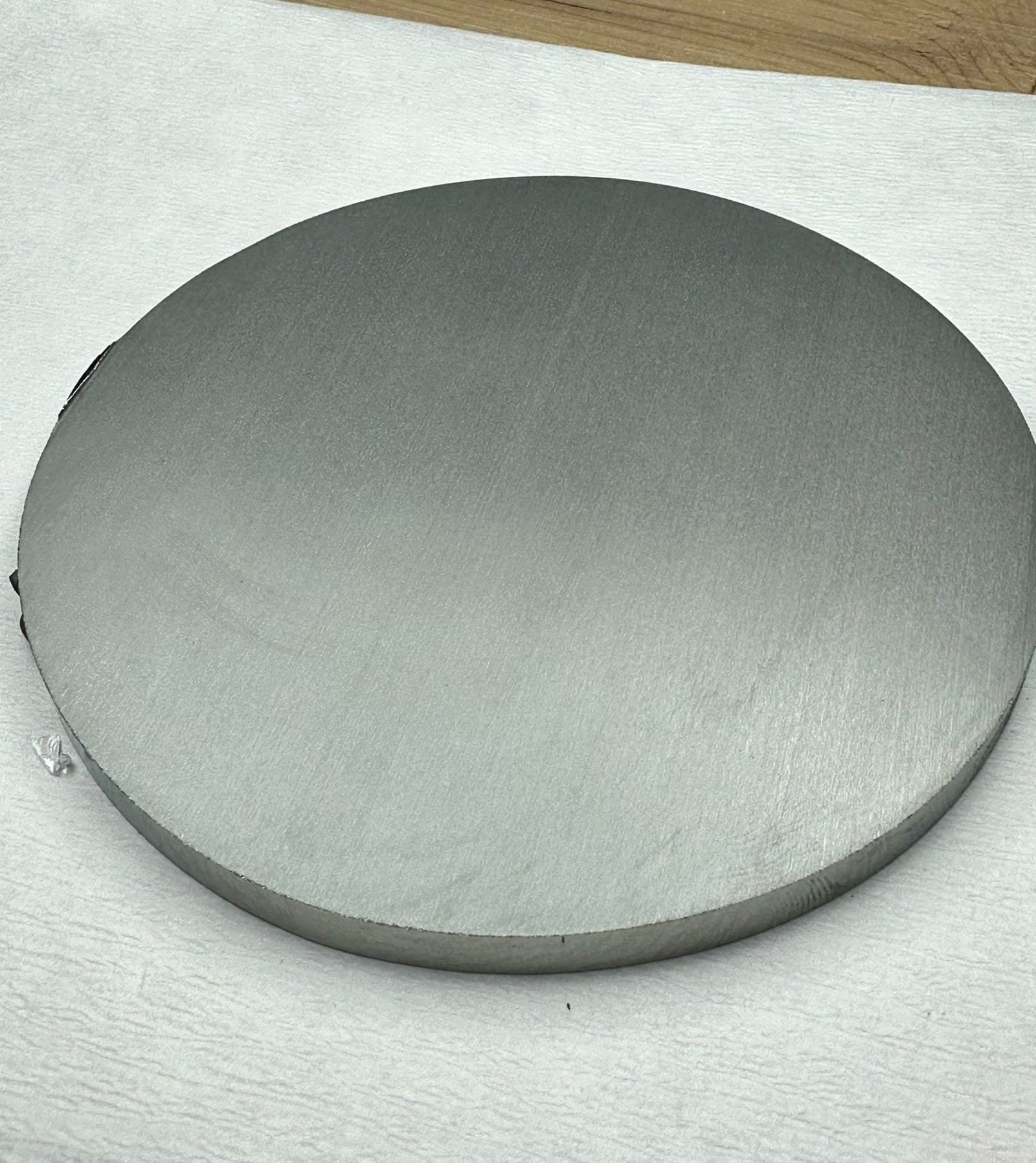 Germanium puck slicing on the endless diamond wire — the loop passing straight through the rod diameter