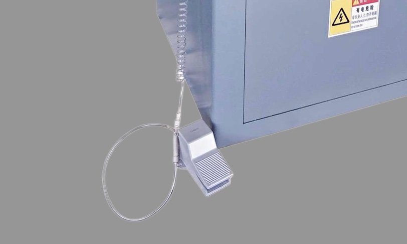 Foot pedal clamping mechanism at the base of the machine